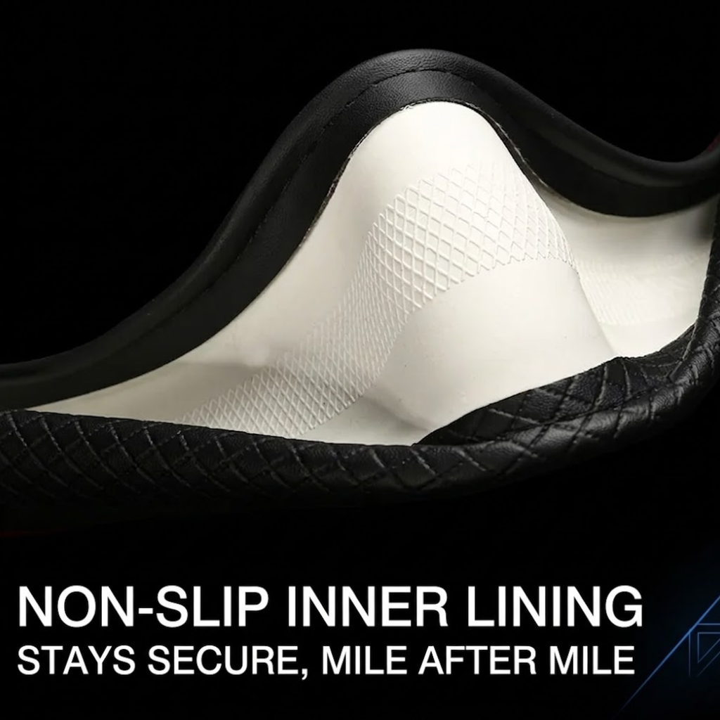 Close-up of a shoe or boot interior showing a white non-slip textured inner lining with a black outer edge, on a black background with the text 'NON-SLIP INNER LINING STAYS SECURE, MILE AFTER MILE'.