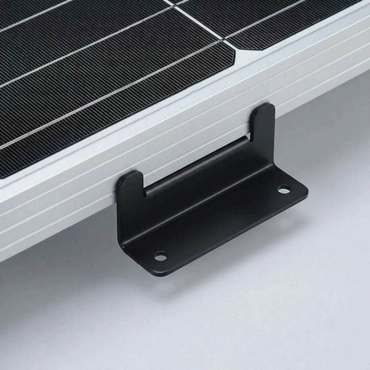 Black aluminium Z-bracket fitted to the frame of a solar panel on a vehicle roof