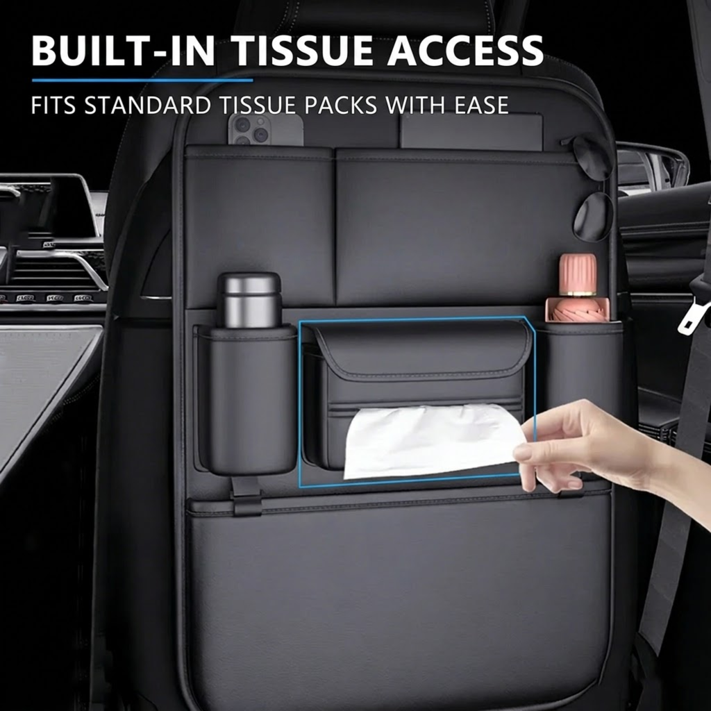 A black car seat tissue holder organizer mounted on a vehicle seat, shown with a hand pulling a tissue from the built-in tissue pocket. The image includes text reading 'BUILT-IN TISSUE ACCESS' and 'FITS STANDARD TISSUE PACKS WITH EASE'.