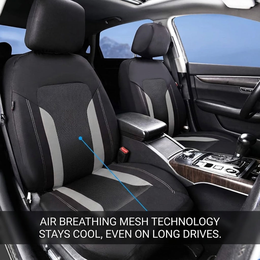 Black and gray car seat covers installed on the front seats of a vehicle interior, with a blue arrow pointing to the mesh fabric on the passenger seat and text at the bottom reading 'AIR BREATHING MESH TECHNOLOGY STAYS COOL, EVEN ON LONG DRIVES.'.