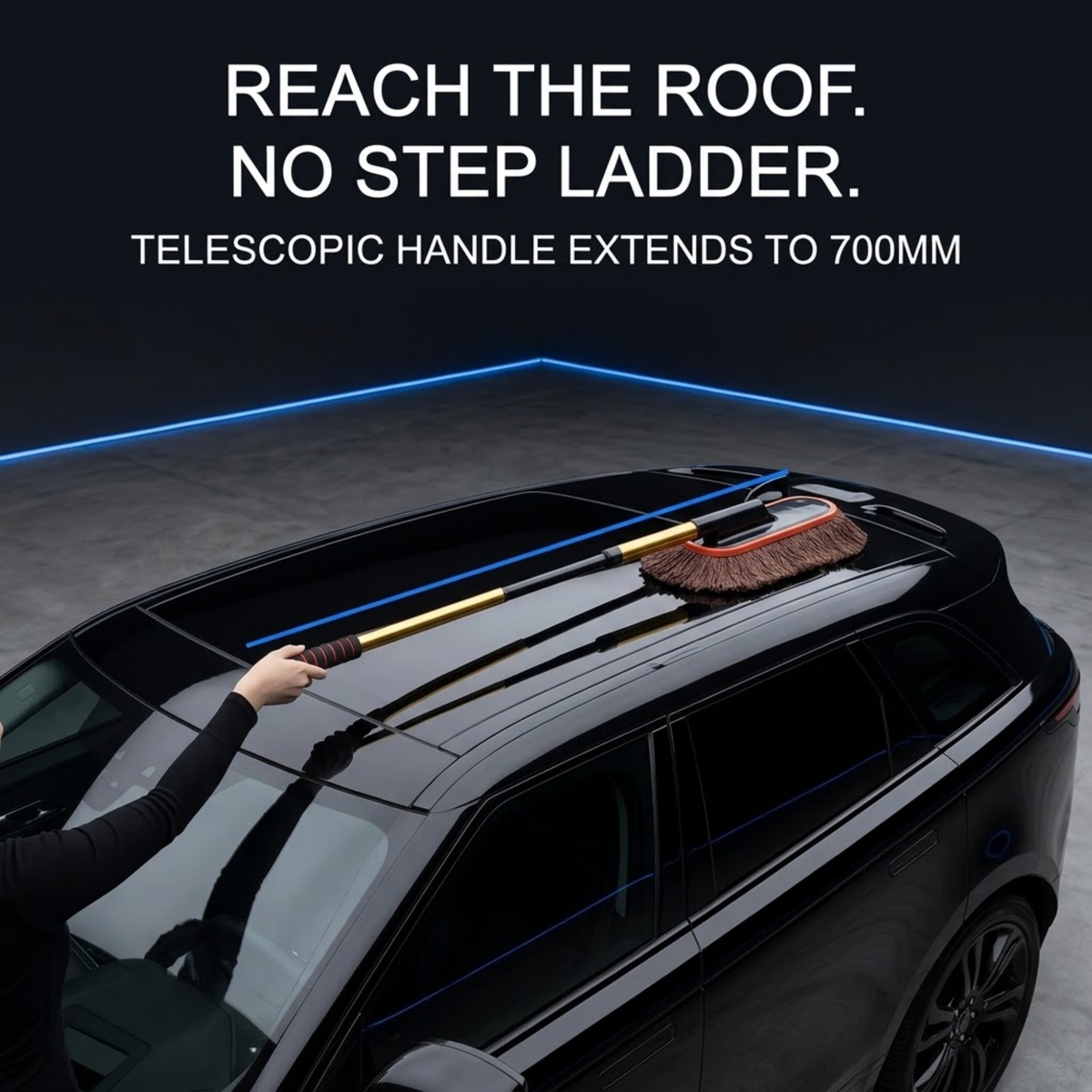 Person dusting the roof of a black SUV using the Telescopic Wax Duster Brush with its handle extended to 700 mm