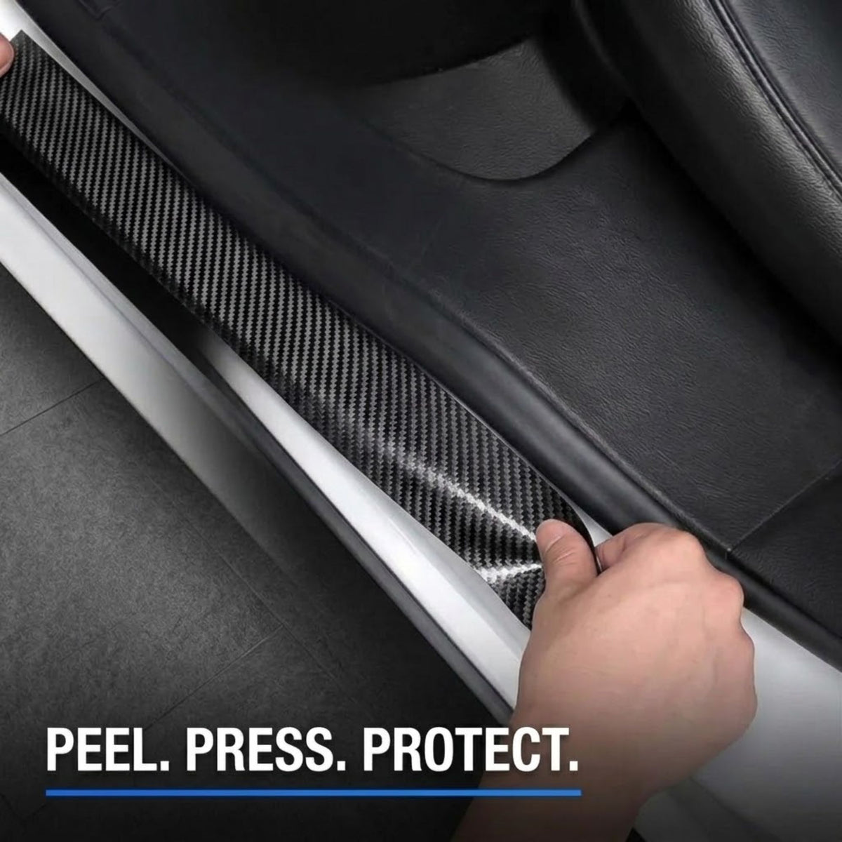A close-up of a hand peeling a carbon fiber patterned door sill protector from a black car door frame, with the text 'PEEL. PRESS.