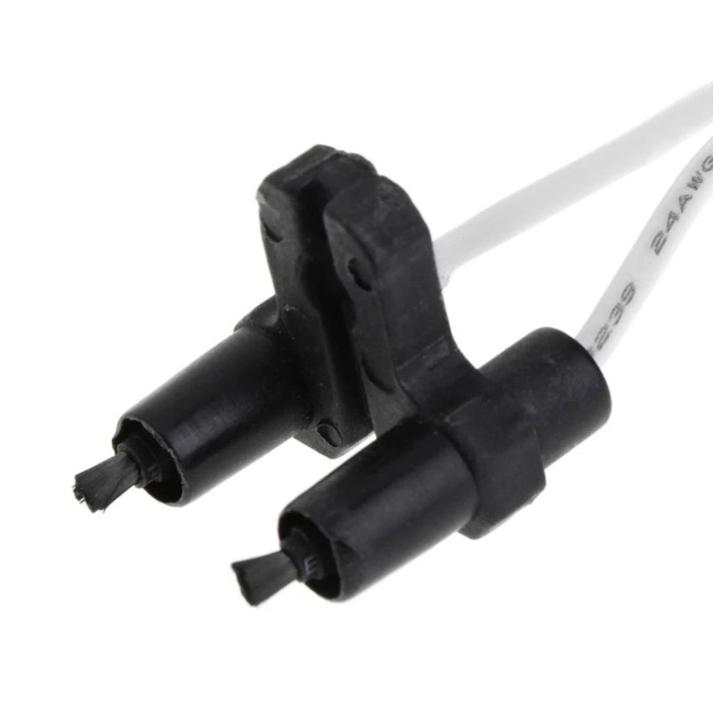 Close-up of the twin ceramic ionizer output terminals with white wiring on the compact car air ionizer module