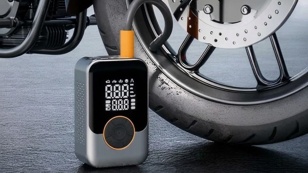 A portable digital motorcycle tire pump shown plugged into a motorcycle wheel, with a blue information panel at the bottom showing compatible uses such as car, SUV, motorcycle, bicycle, air bed, and swimming pool.