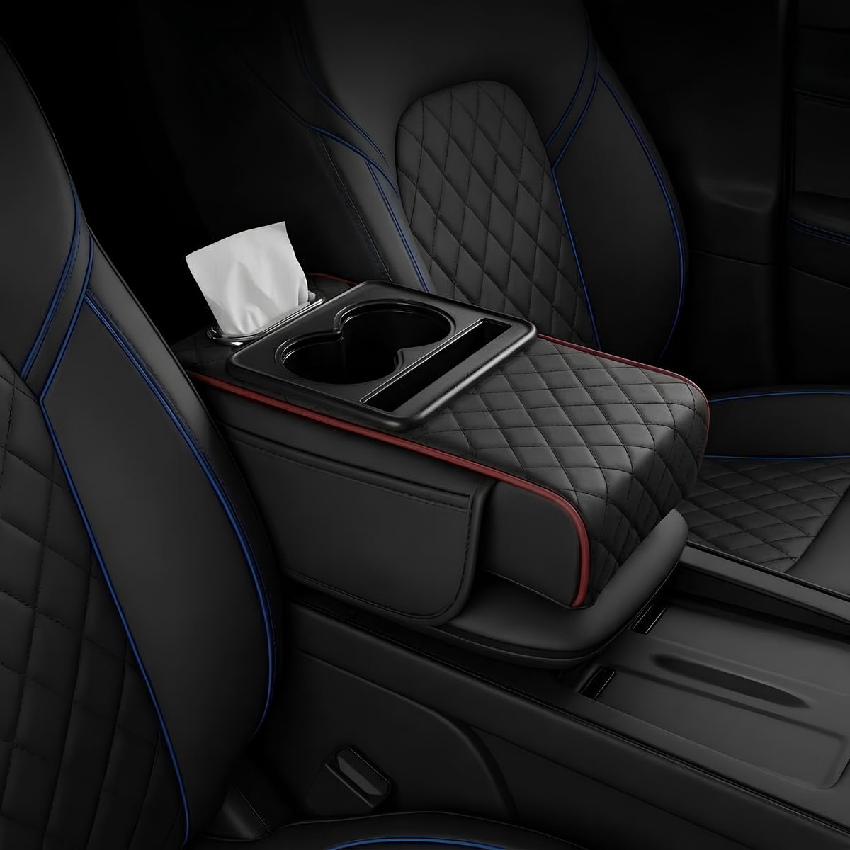 Black car center console armrest cover with quilted diamond stitching, red contrast stitching, and a built-in cup holder, installed on a car's center console between black quilted seats with blue stitching.