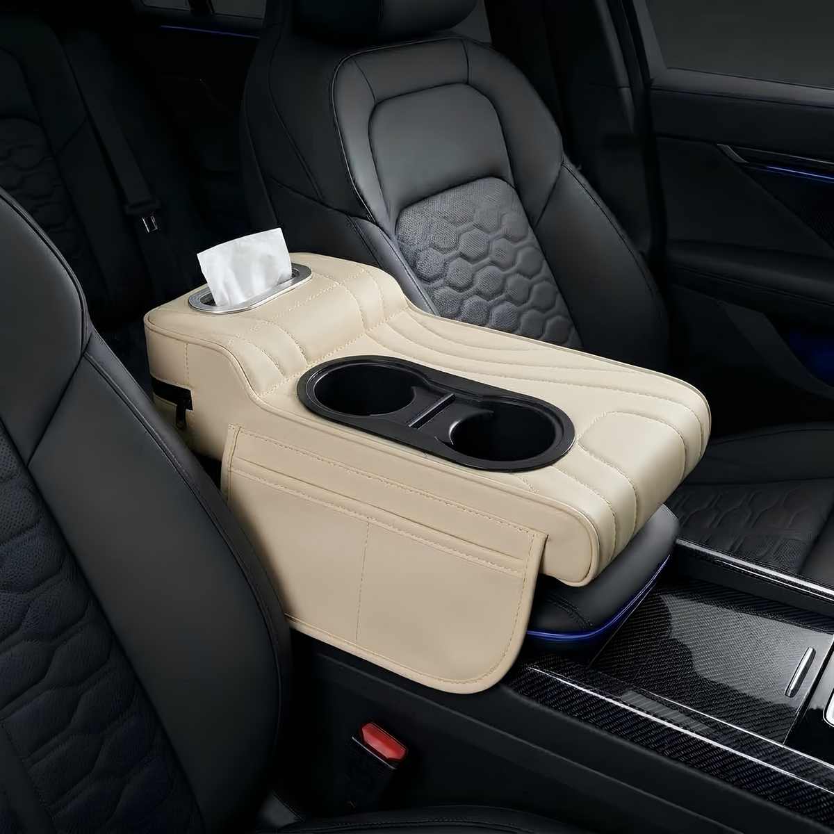 A beige leather car center console armrest with integrated cup holders and a tissue dispenser slot, shown installed between two black car seats.