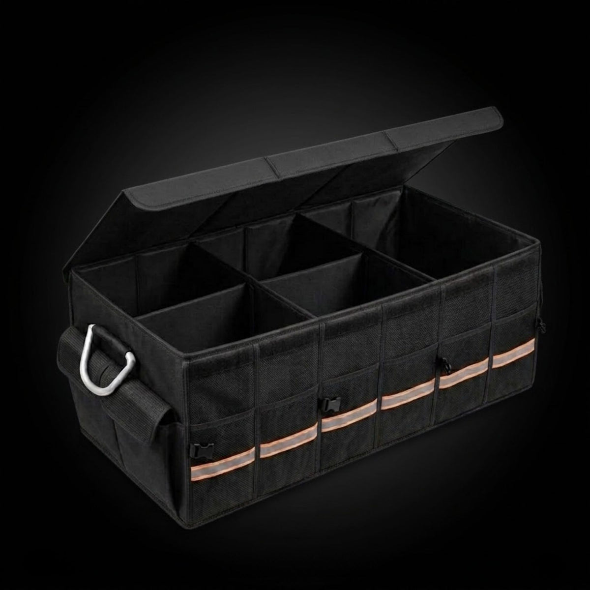 A black utility storage organizer bag with a hinged lid, divided into multiple compartments, featuring a silver metal D-ring handle and reflective orange stripes on the front, shown against a dark studio background.
