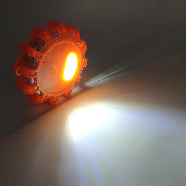 Close-up of a Rechargeable LED Road Flare glowing bright white and orange at night