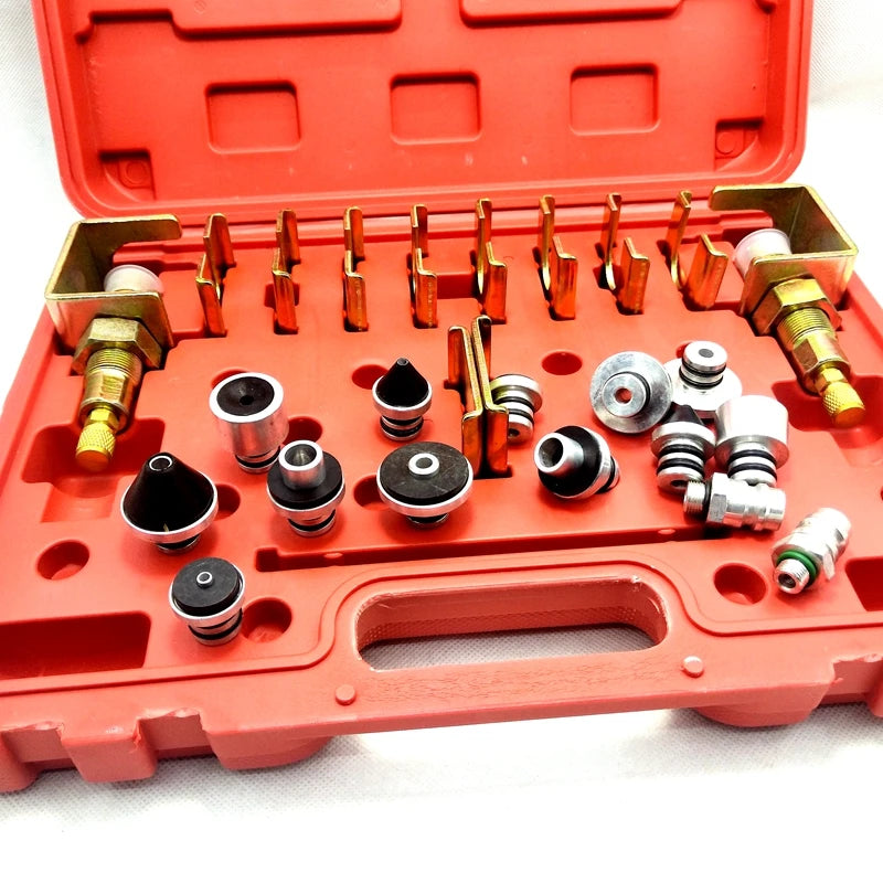 Close-up of A/C Leak Test Plug Kit open case with brass clamps, sealing plugs and adaptors