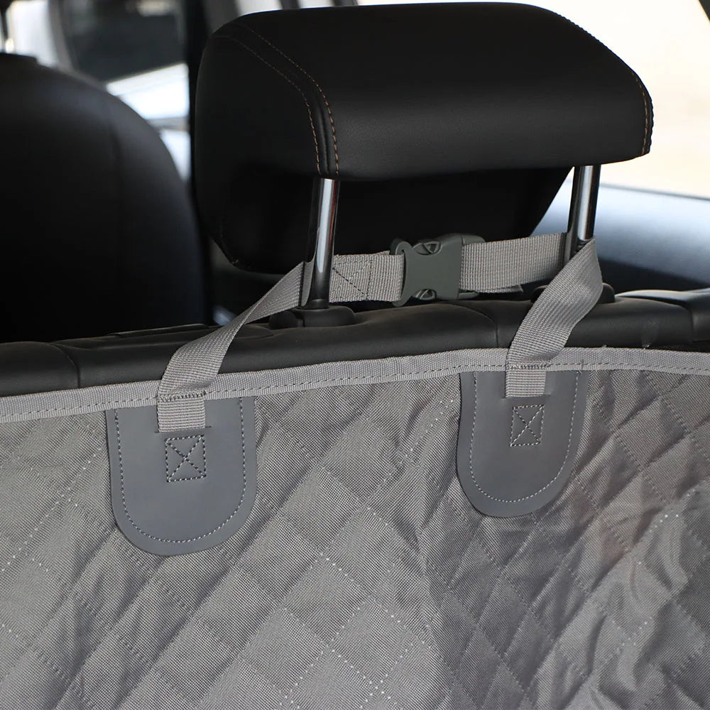 Waterproof Dog Boot Liner adjustable strap secured around a car headrest for a secure fit