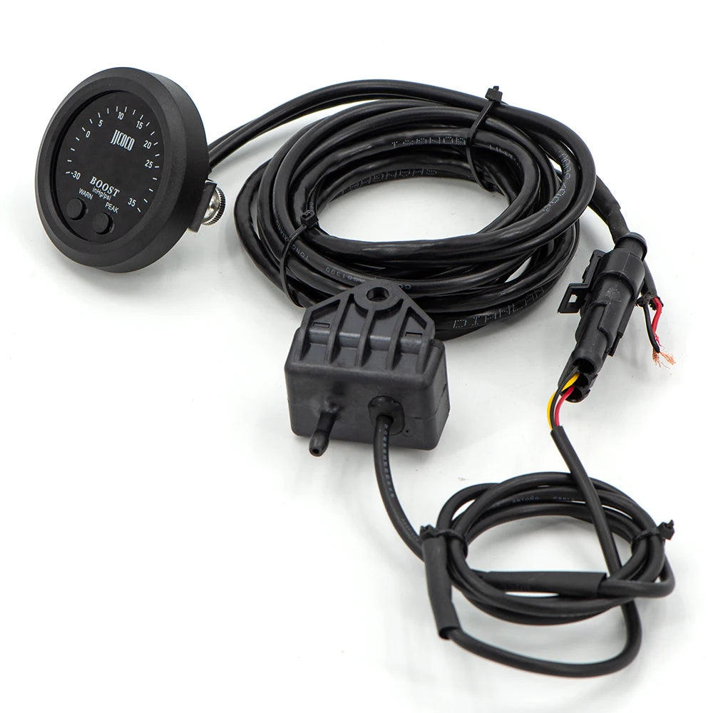 Digital Turbo Boost Gauge with wiring harness, pressure sensor module and connector cables laid out on a white background