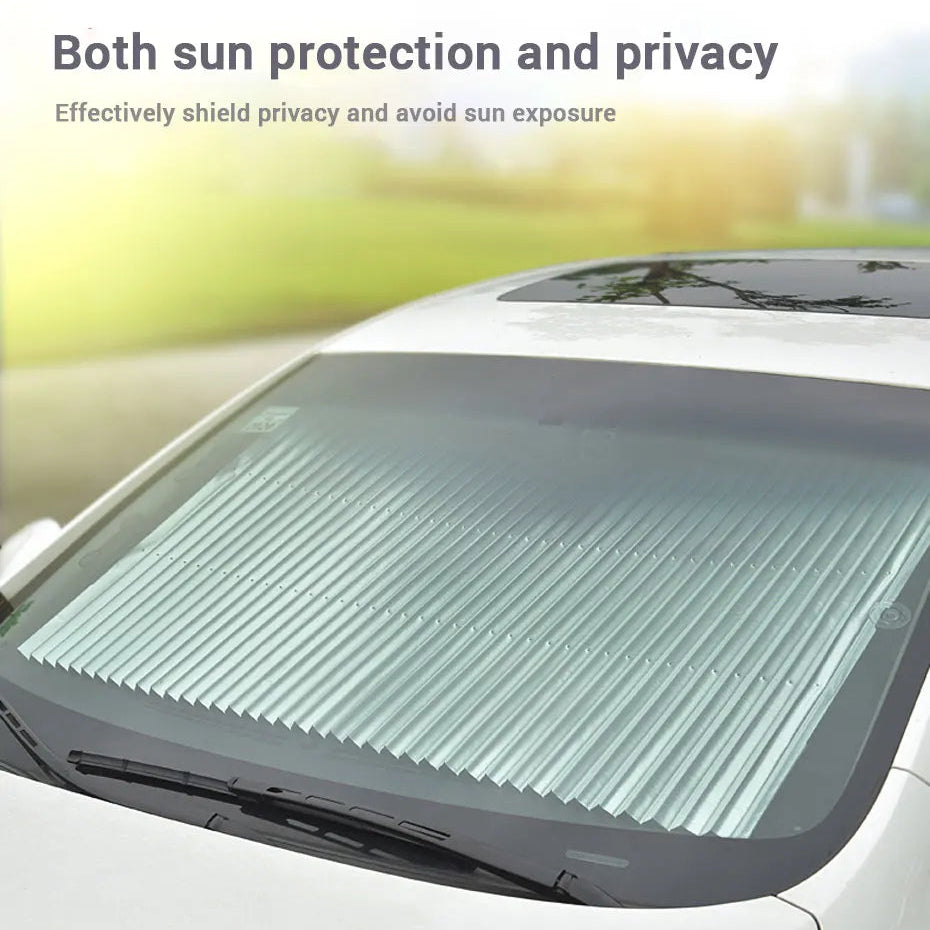 Retractable Windscreen Sunshade extended across the inside of a white car windscreen for sun protection and privacy