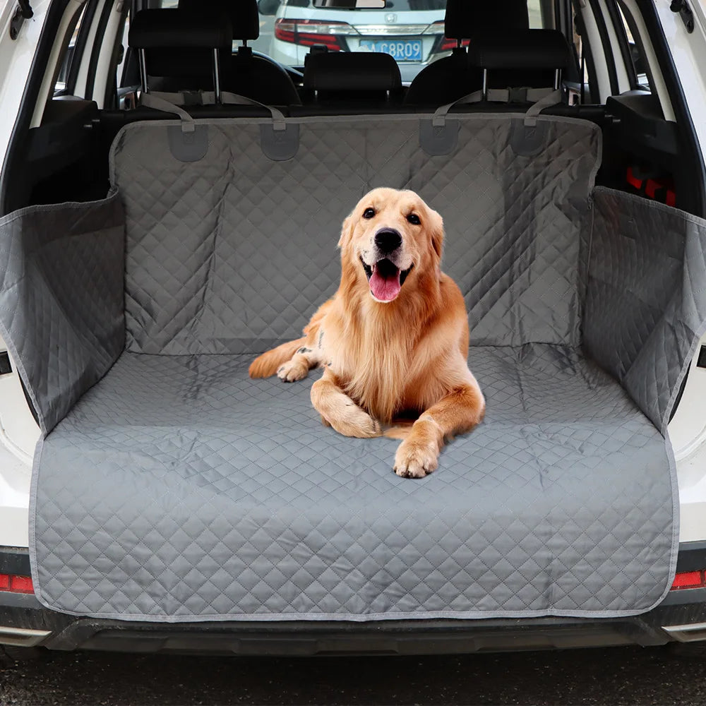 Golden retriever sitting comfortably in a car boot fitted with the Waterproof Dog Boot Liner
