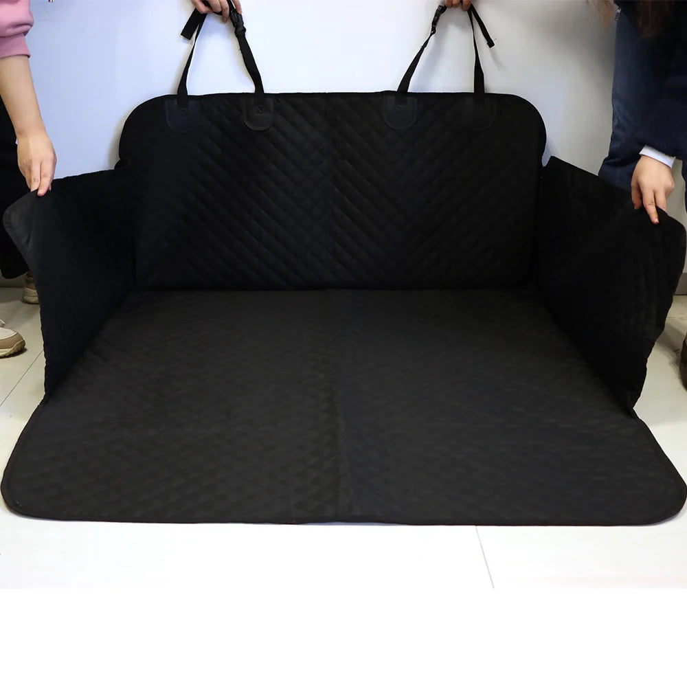 Waterproof Dog Boot Liner in black colourway held open to show the full cargo cover shape