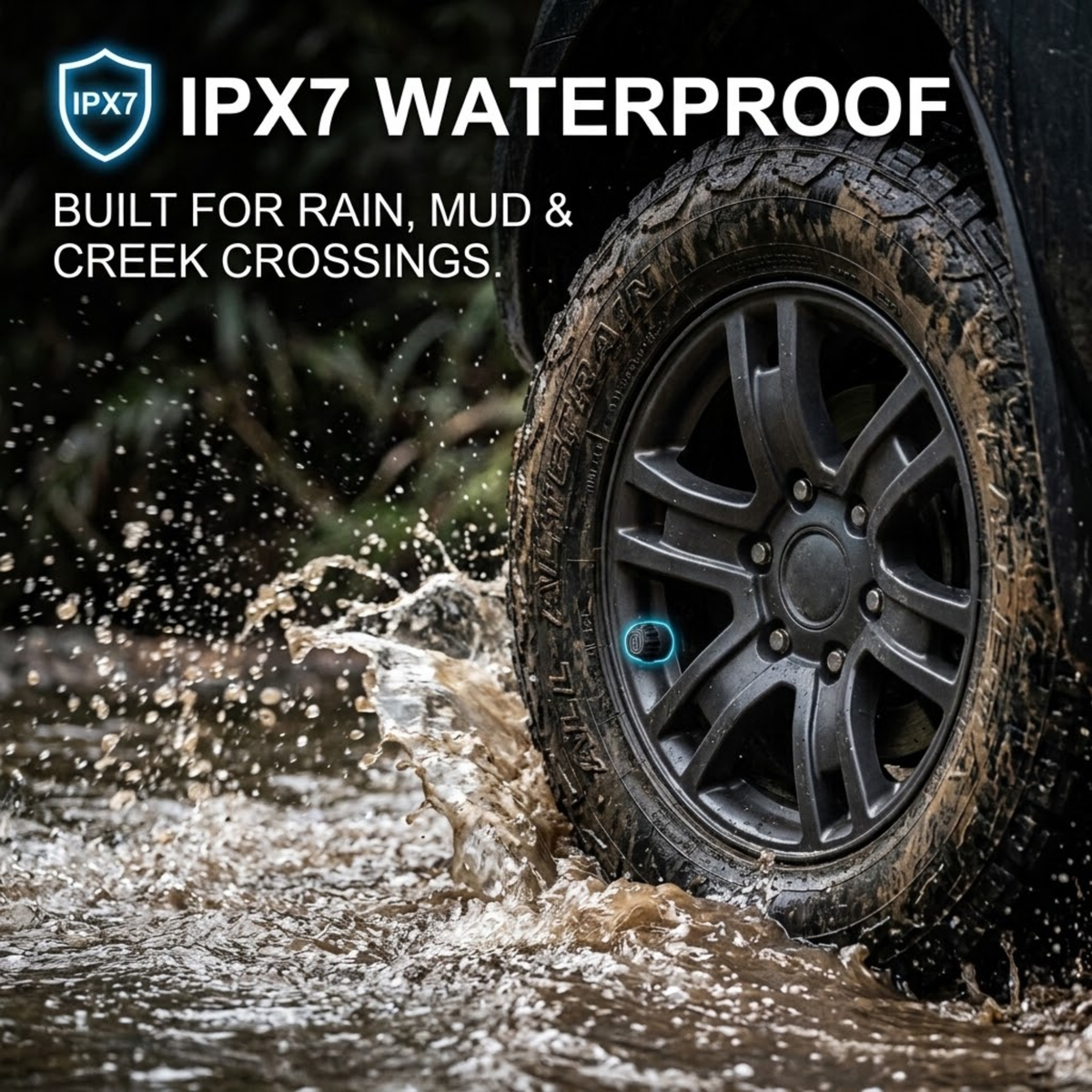 Muddy 4WD tyre fitted with an IPX7 waterproof 4WD & Caravan Tyre Monitor sensor splashing through a creek crossing