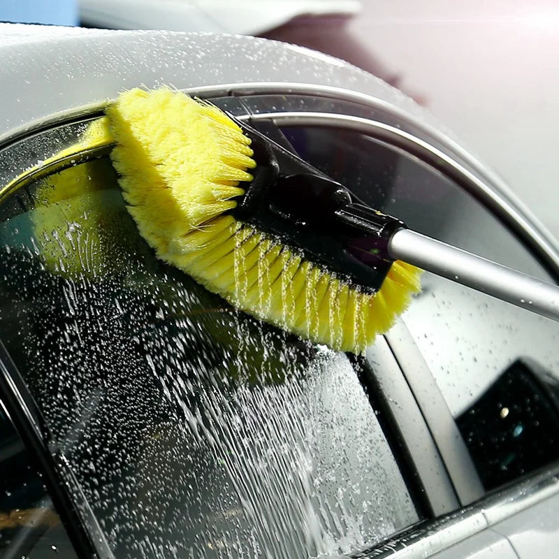 Ultra-Soft Detailing Brush spraying water across a car roof and window edge