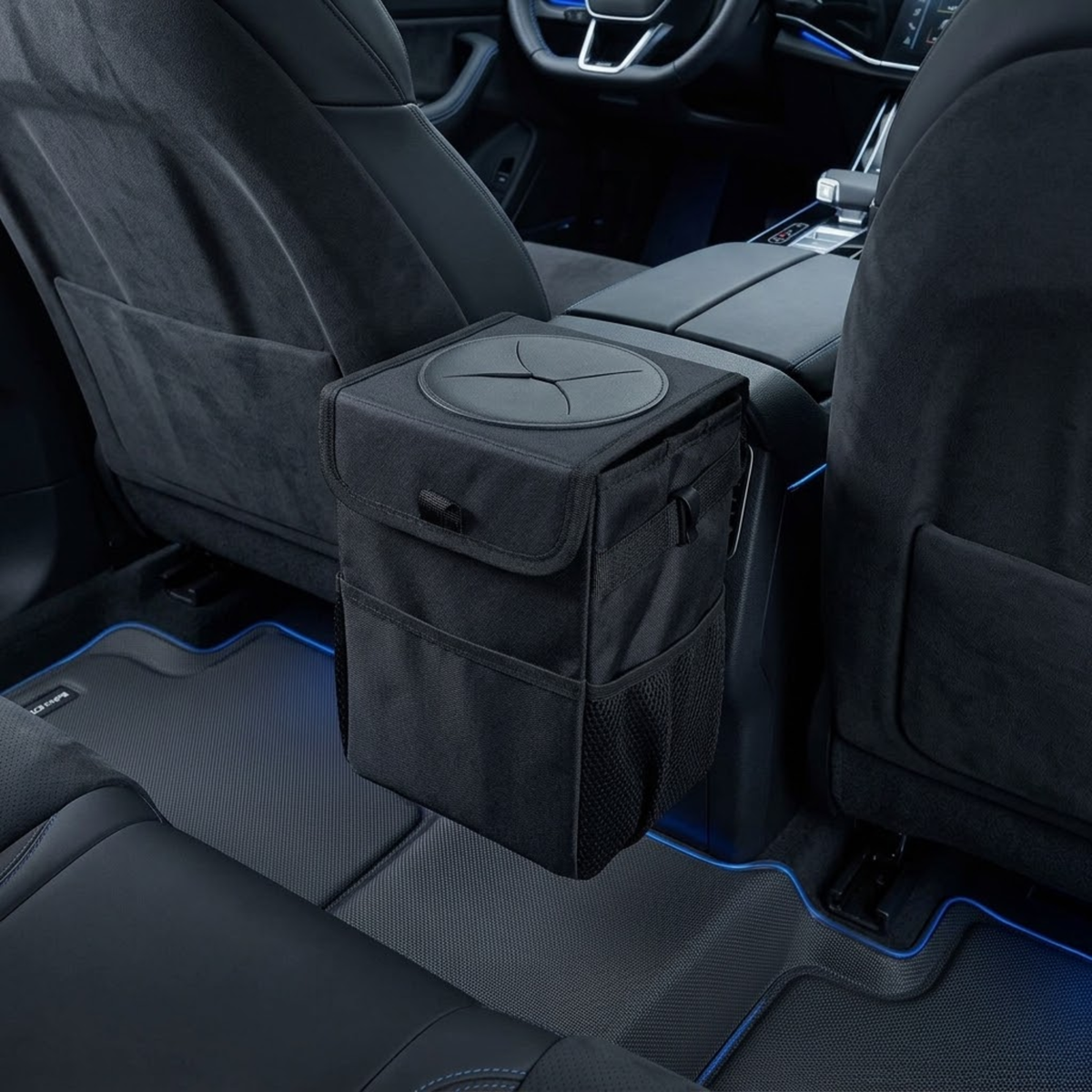 Collapsible Car Rubbish Bin mounted between rear seats in a vehicle interior