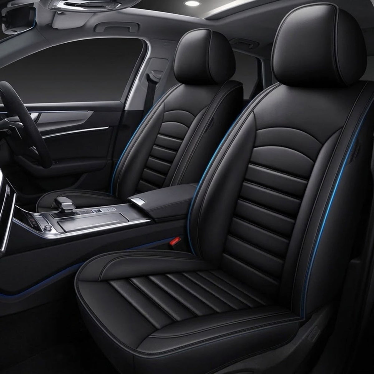 Black car seat covers with blue contrast stitching installed on the front seats of a vehicle interior.