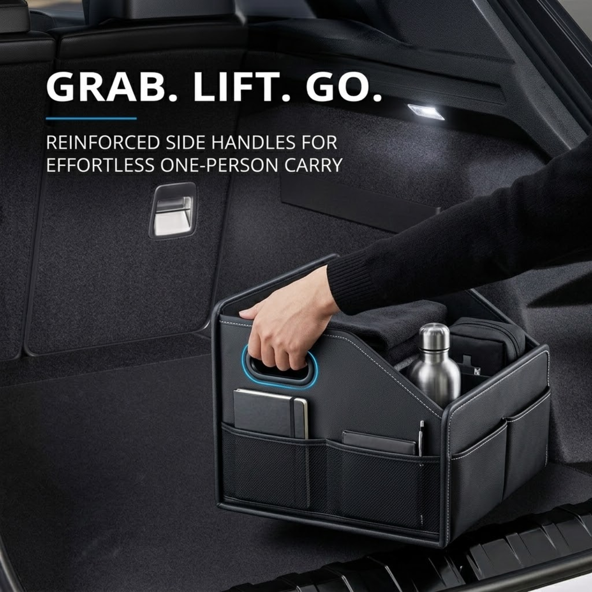 Hand lifting a packed Leather Boot Organiser by its reinforced side handle in a car boot