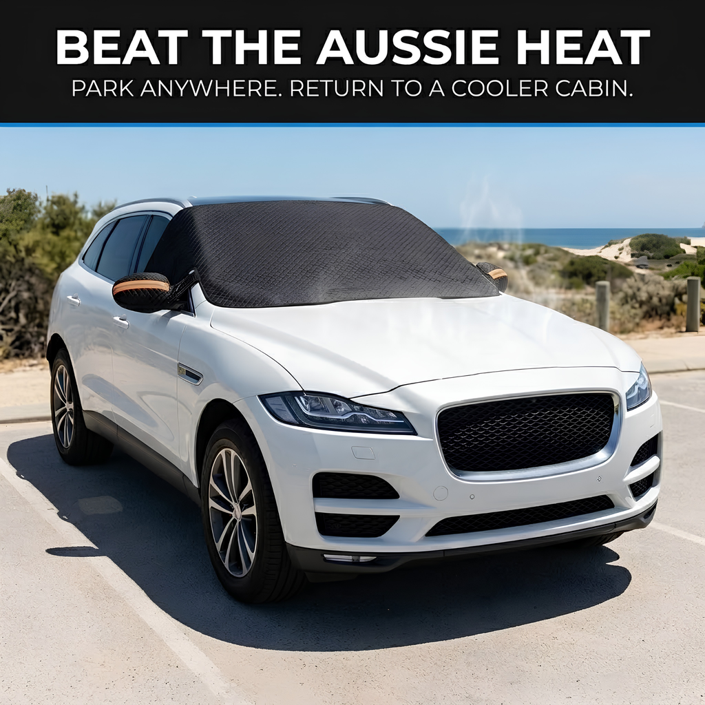 Magnetic Windscreen Sun Shade Cover fitted to a white SUV parked in a sunny beachside car park