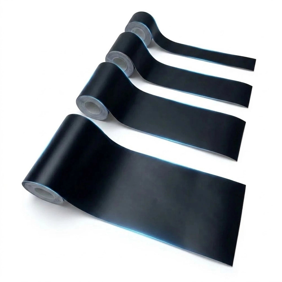 Four rolls of matte black trim tape, car adhesive, partially unrolled to show the backing, arranged diagonally on a white background.