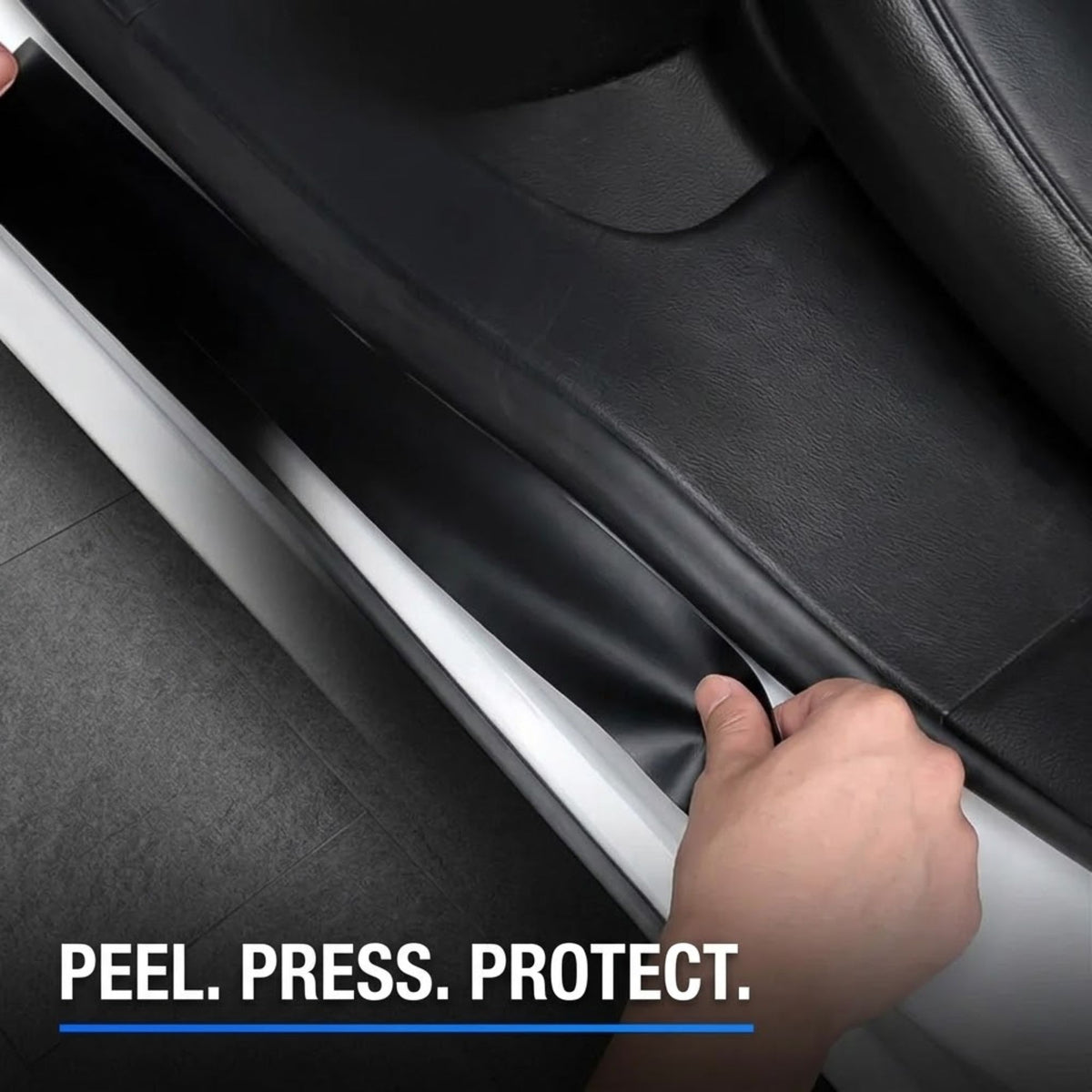 A close-up of a hand peeling back a black protective film from a car door panel, with the text 'PEEL. PRESS.