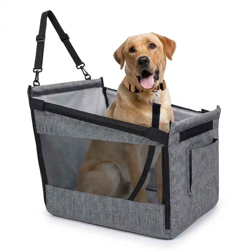 Yellow Labrador sitting in a grey portable car pet travel seat with mesh sides and hanging straps