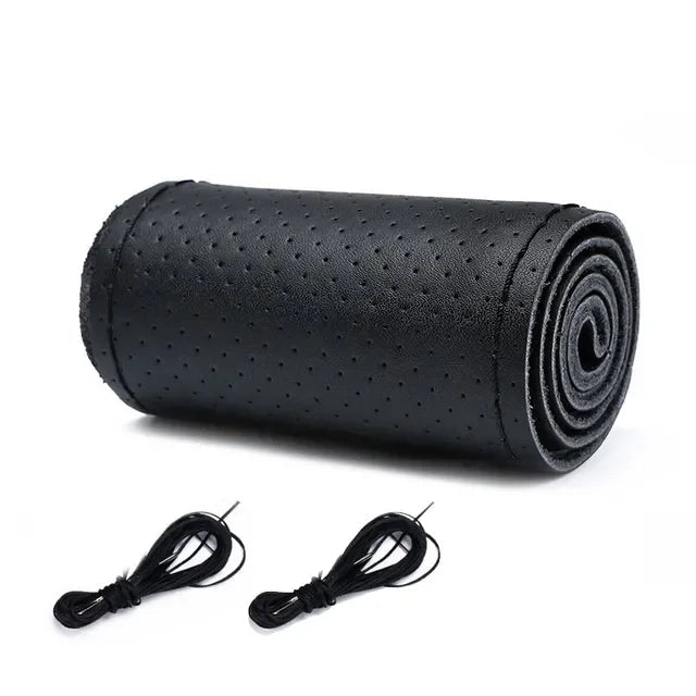 DIY Leather Steering Wheel Cover in all-black perforated leather with needle and thread, rolled for easy fitting
