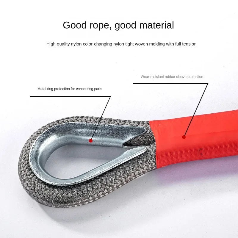 Close-up of the 4x4 recovery strap loop end showing metal ring reinforcement and wear-resistant red rubber sleeve protection