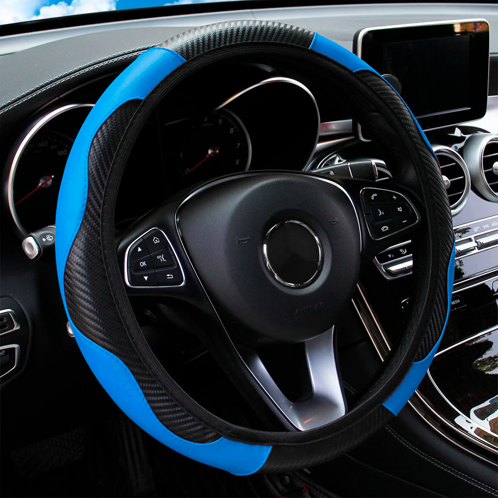 Blue and black PU leather steering wheel cover with carbon fibre panel fitted to a car steering wheel