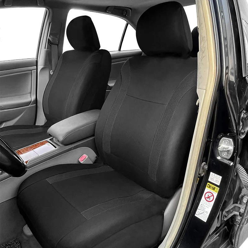 Black Breathable Mesh Seat Cover installed on car front seat viewed through open door with headrest and centre console visible
