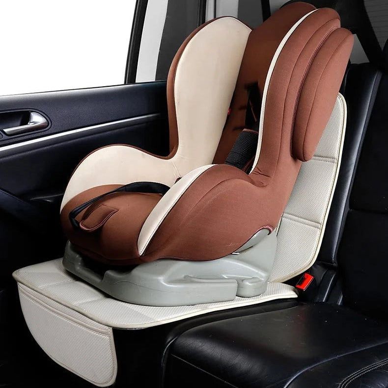 Child car seat with ISOFIX base secured on top of a cream ISOFIX Child Seat Protector in a vehicle