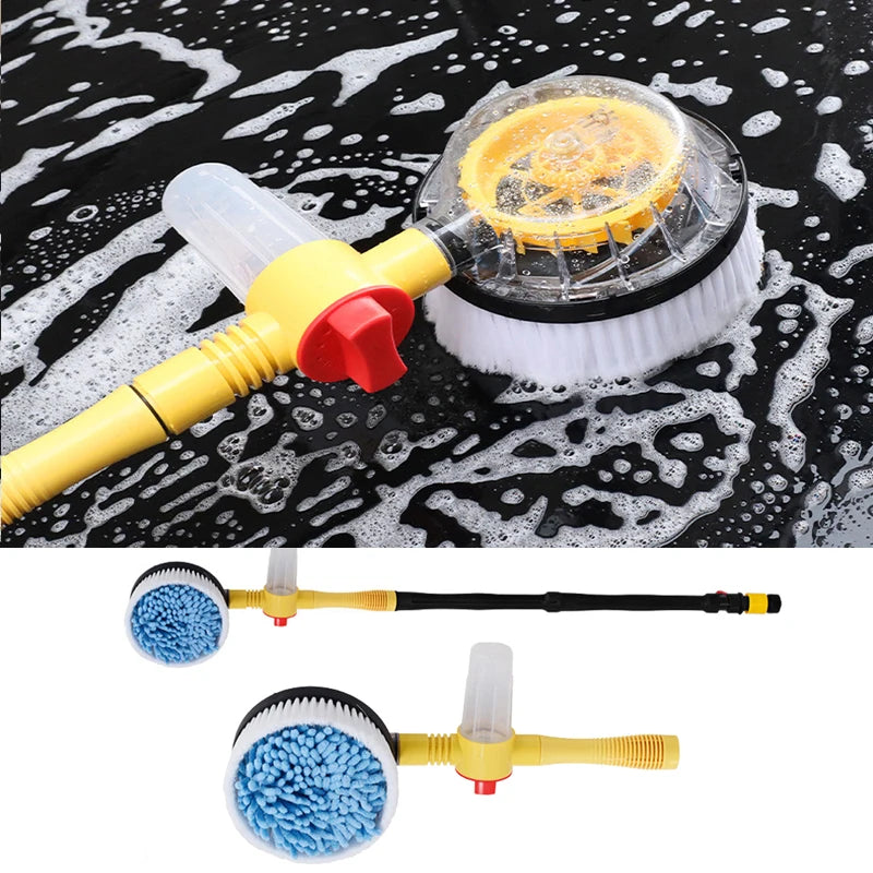 Blue chenille rotating wash brush covered in car wash foam on a soapy black car panel
