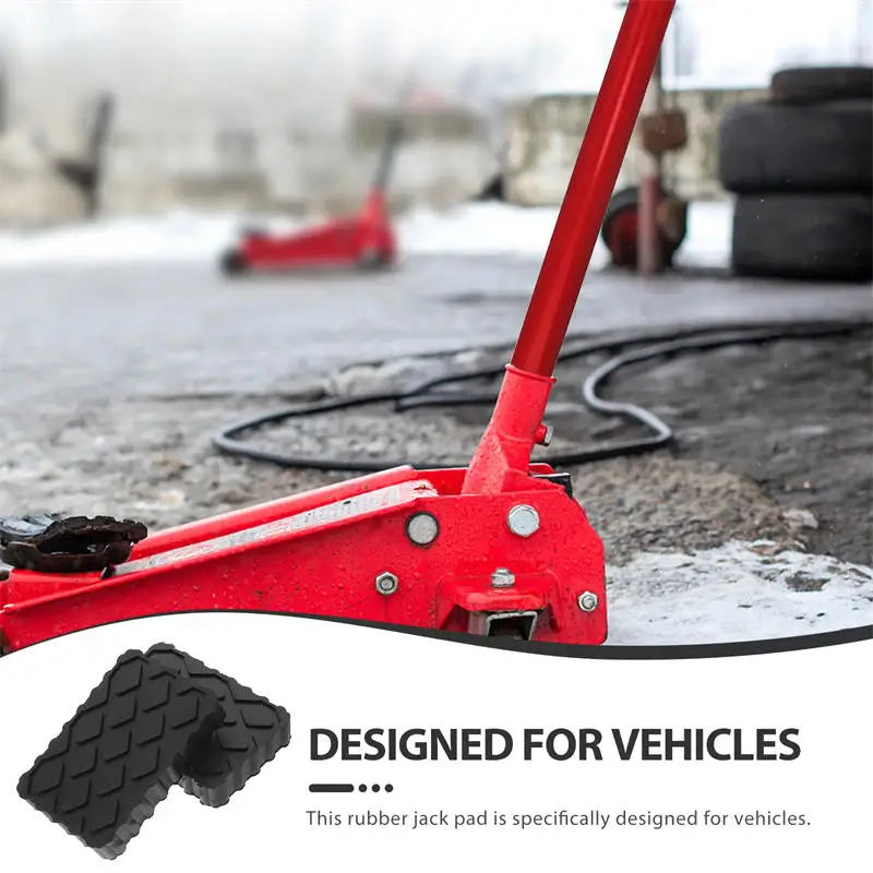 Heavy-Duty Jack Pad beside a red trolley jack and stacked tyres, designed for vehicle lifting