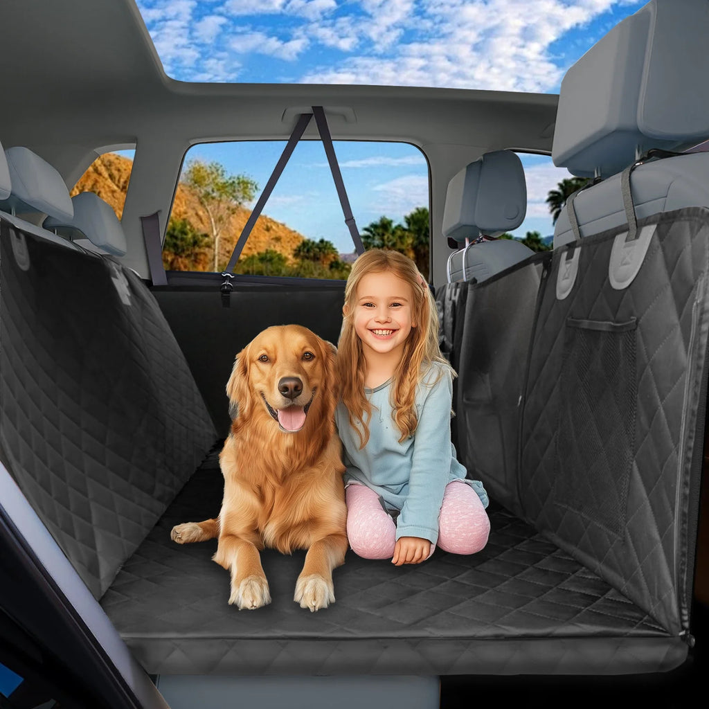 Golden retriever and young girl sitting together on the Tri-Board Dog Seat Extender platform in a car back seat