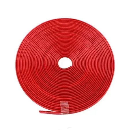 Coiled red rubber wheel rim protector strip roll photographed on a white background