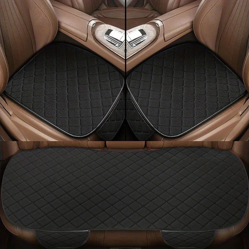 3-Piece Seat Cushion Set in black with red stitching fitted to front and rear seats of a car with tan leather interior