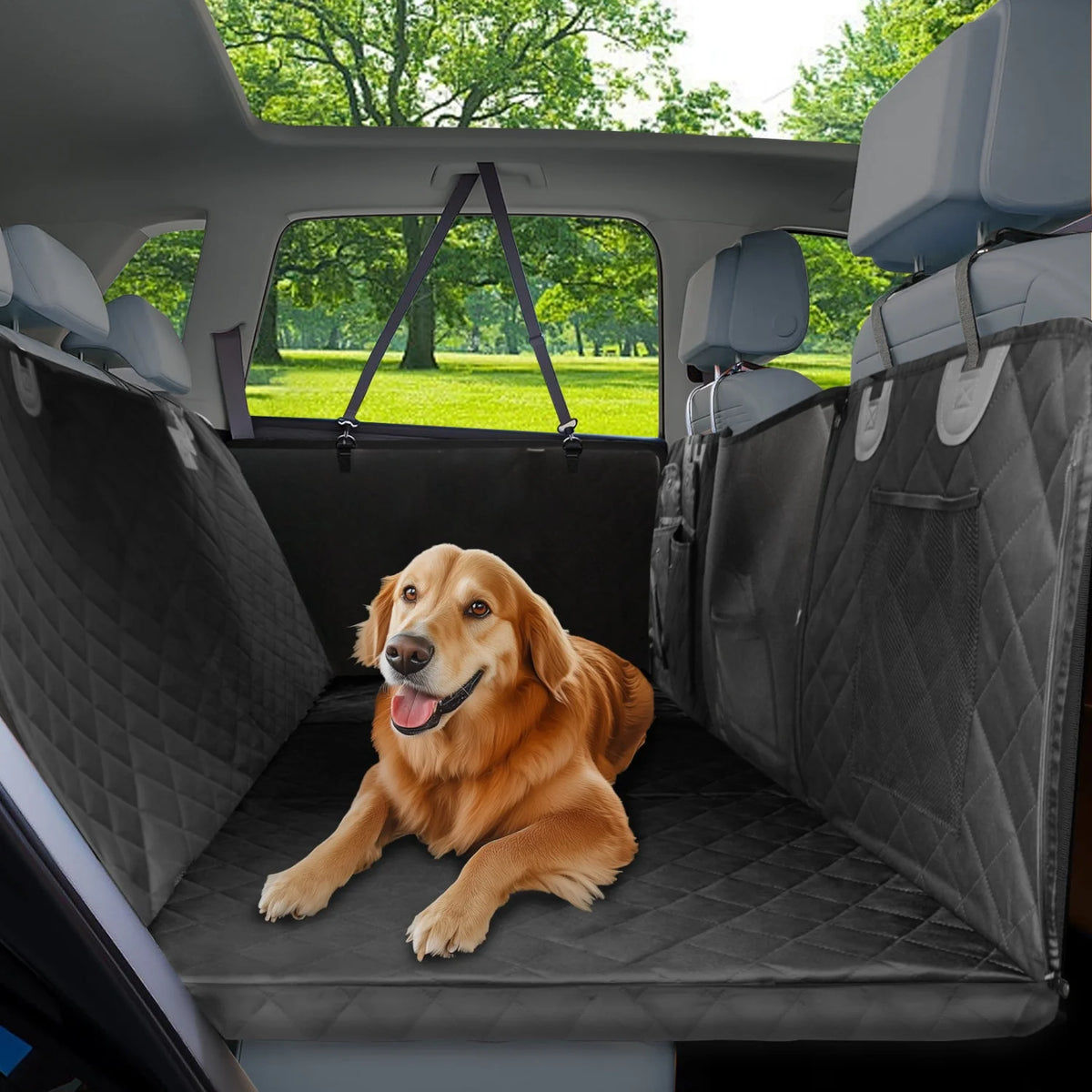 Golden retriever lying on the Tri-Board Dog Seat Extender fitted across a car back seat, creating a flat quilted platform