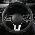 Diamond Leather Steering Wheel Cover in all-black leather, installed on a steering wheel