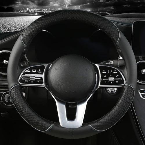 Diamond Leather Steering Wheel Cover in all-black leather, installed on a steering wheel