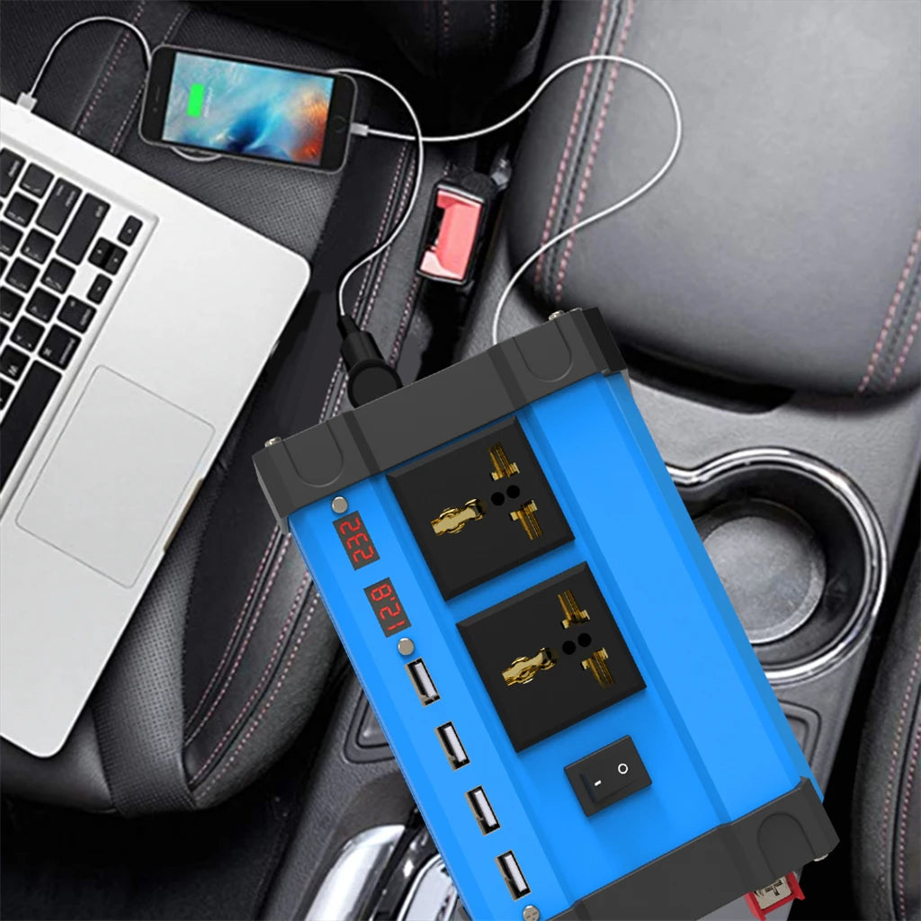 Solar inverter charging a phone and laptop from a car centre console with USB and AC outlets