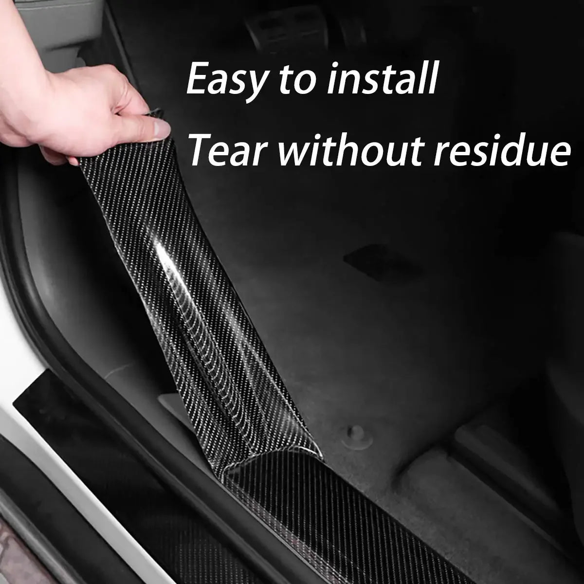 Hand applying black carbon fibre wrap tape to a car's door sill, captioned Easy to Install Tear Without Residue.