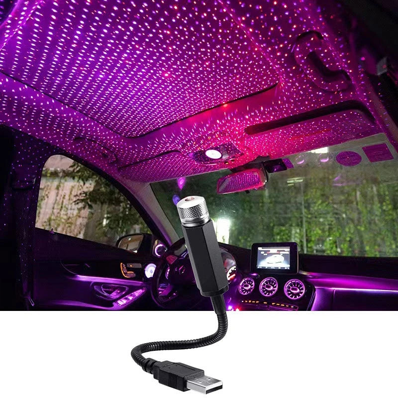 Tri-Colour Star Projector purple starlight covering car roof lining and dashboard at night