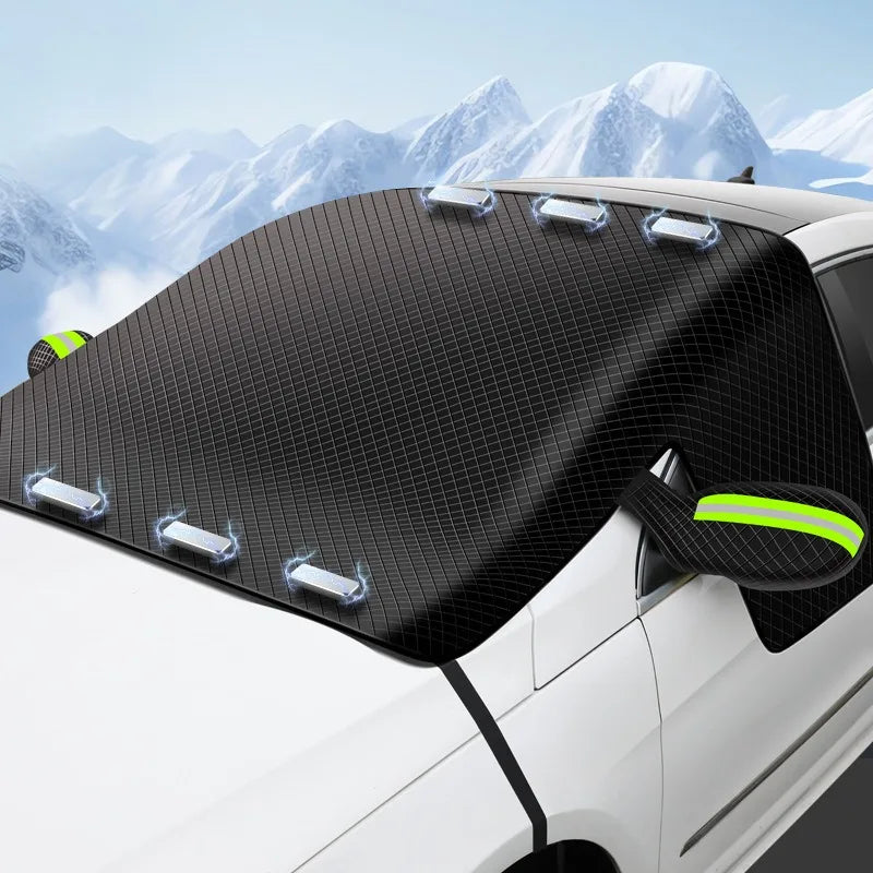 Close-up of the Magnetic Windscreen Frost Cover secured over a car's windscreen and side mirror against a snowy mountain backdrop