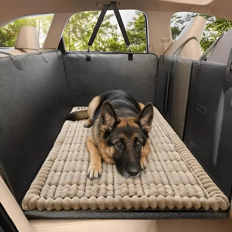 Beige Plush Pet Car Cushion fitted as a waterproof boot liner in a car cargo area with a German Shepherd resting on it