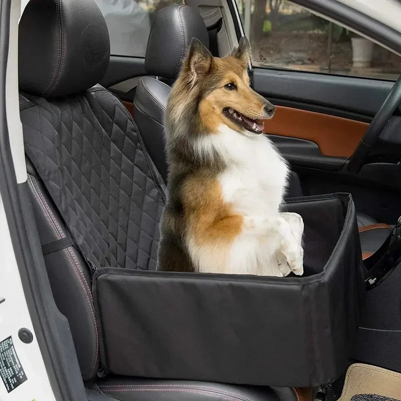 Rough collie sitting up in the black Waterproof Dog Car Hammock booster seat fitted to a car's front passenger seat