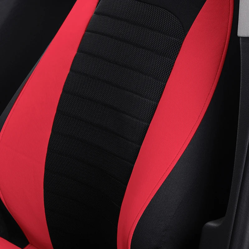 Close-up of the black and red ribbed mesh fabric texture on a front bucket seat cover