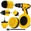 Yellow cordless drill brush cleaning set with four scrub brush heads and extension attached to a power drill