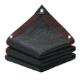 HDPE Sun Shade Net in black, folded with reinforced brown edge binding and metal grommets, on a white background