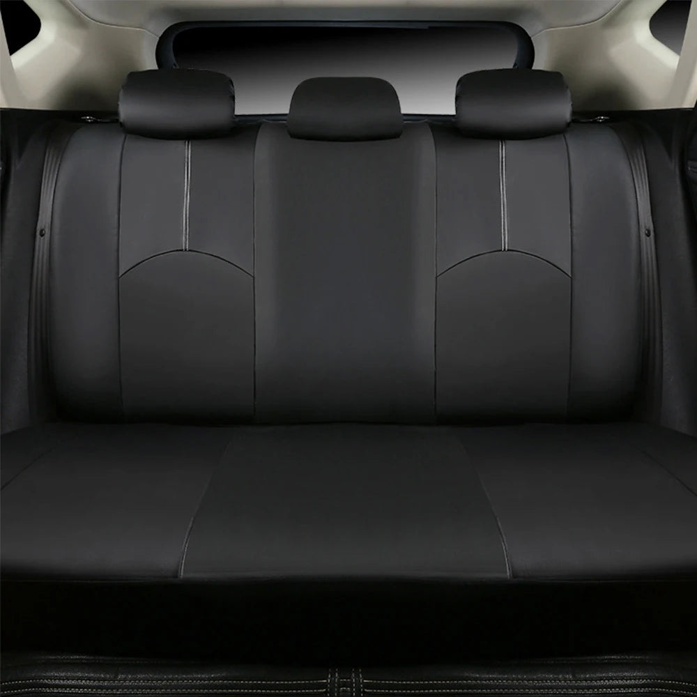 Universal Seat Cover Set rear bench seat installed in black leather viewed from behind headrests inside car cabin